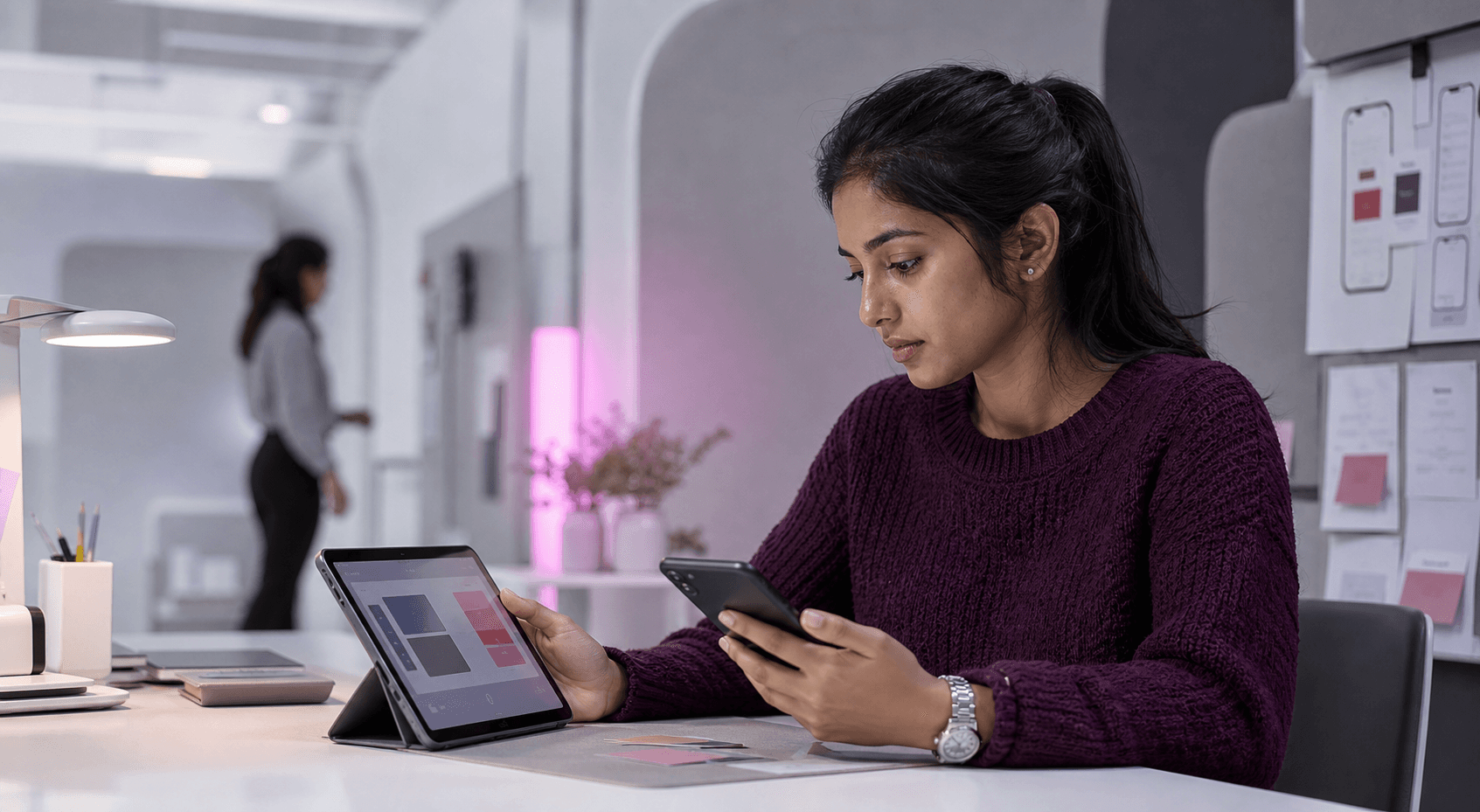 Mobile product engineer testing an application across smartphone and tablet devices