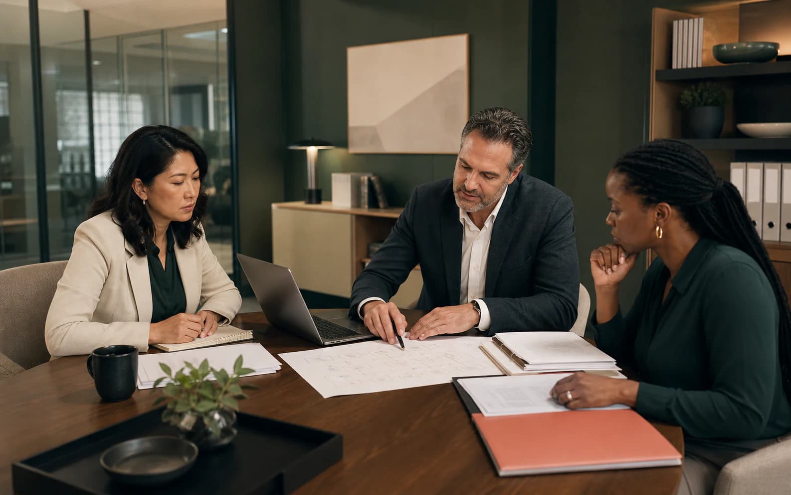 Finance operations professionals reviewing a reporting workflow